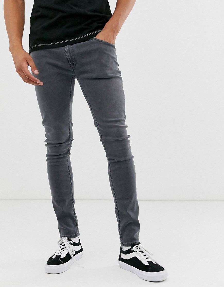 Skinny Lin jeans i forvasket betongrå og smal pasform fra Nudie Jeans Co