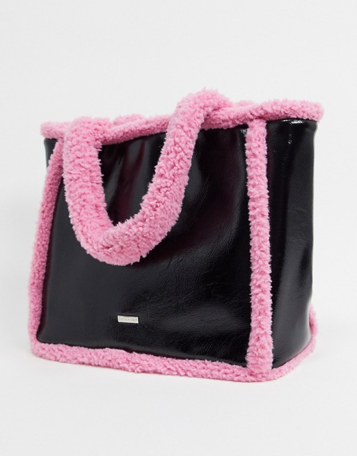Skinnydip borg trimmed tote bag in black and pink