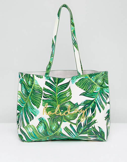 Skinnydip – Einkaufstasche mit Palmenprint und aufgesticktem „Holiday“-Schriftzug