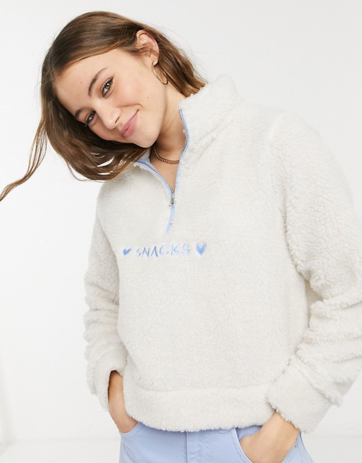 Skinnydip half zip sweatshirt with love snacks embroidery