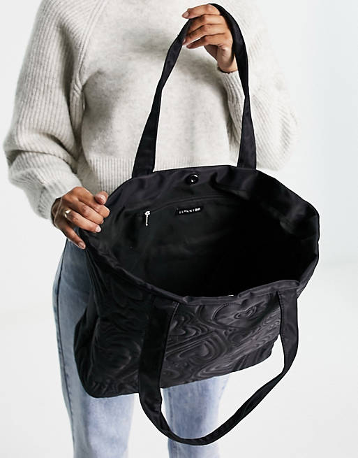 Skinnydip padded tote bag in nylon black heart print | ASOS