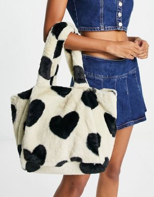 Skinnydip plush faux fur tote bag in beige with black heart print