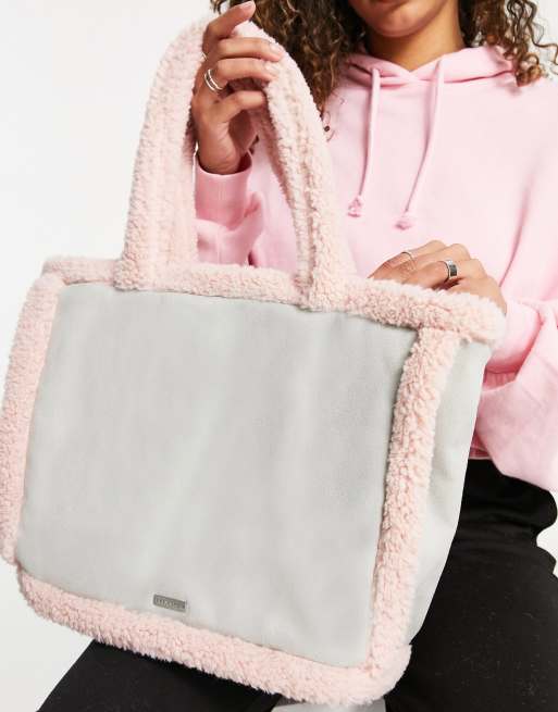 Skinnydip sherpa trimmed tote bag in pastel blue and pink Travel