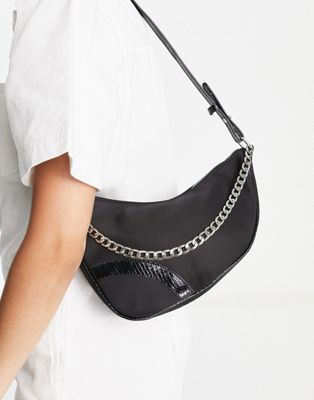 Skinnydip shoulder bag in black nylon with patent trim and silver chain