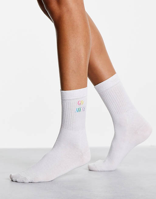 Skinnydip socks with rainbow 'go away' slogan