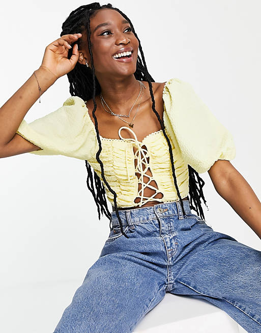Skylar Rose puff sleeve crop top with criss cross tie detail in yellow