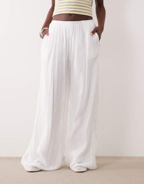 SNDYS cotton blend elasticated waist crinkle wide leg trouser in white - view 1