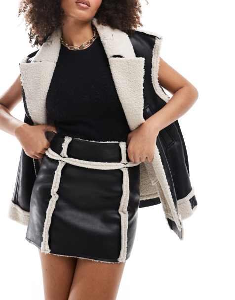 SNDYS leather look contrast borg detail mini skirt co-ord in black - view 1