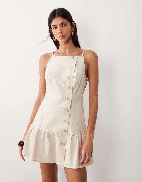 SNDYS – Minikleid aus Leinen-Baumwollmix in Hellbeige mit eckigem Ausschnitt, Knopfdetail und Rüschensaum - view 1