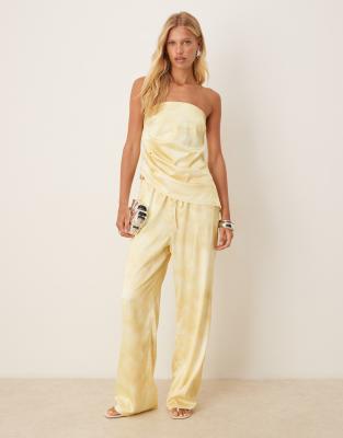 SNDYS SNDYS satin drawstring waist wide leg trousers co-ord in yellow blurred print