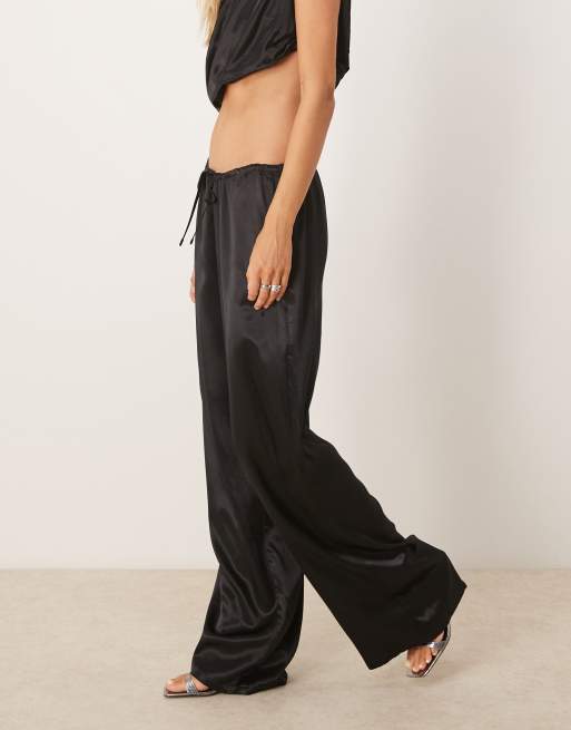 SNDYS satin drawstring wide leg pants in black - part of a set