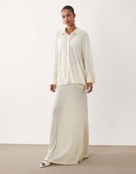 SNDYS soft fine knit semi sheer wide cuff shirt and  twist front detail maxi skirt co-ord in off white - view 1