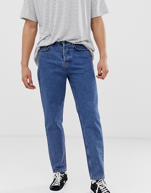 Solid tapered dad fit jeans in mid blue wash | ASOS