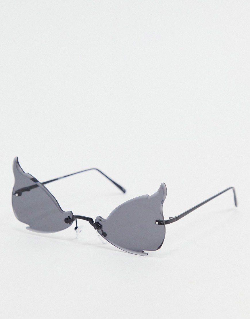 фото Солнцезащитные очки с затемненными линзами изогнутой формы без оправы с дужками из черного металла asos design halloween-черный
