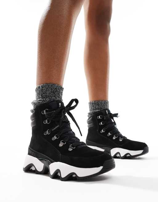 Sorel Kinetic Impact Conquest Plus waterproof suede snow boots in black and sea salt