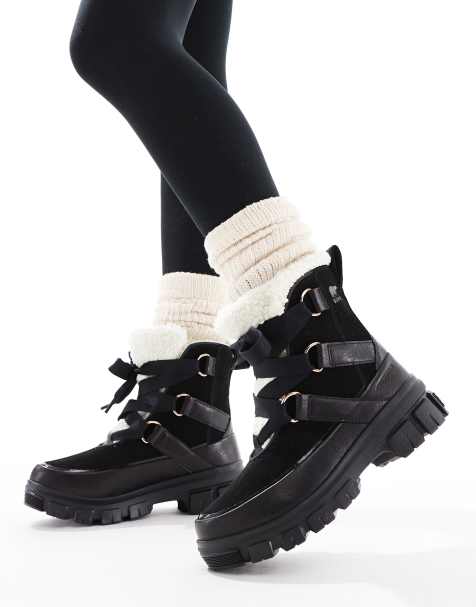 Sorel – Torino V Resort – Wasserdichte Schneestiefel aus Leder in Schwarz mit Kunstpelzbesatz in Kalkweiß und Fleece-Futter - view 1