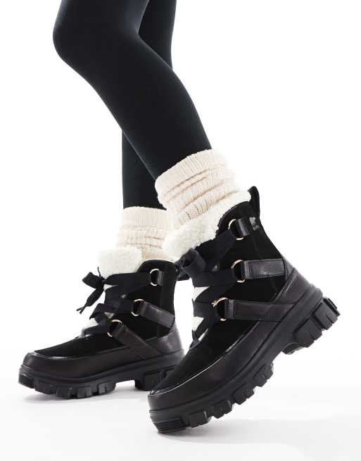 Sorel - Torino V Resort WP - Waterbestendige leren sneeuwlaarzen met voering van fleece imitatiebont in zwart en krijtwit