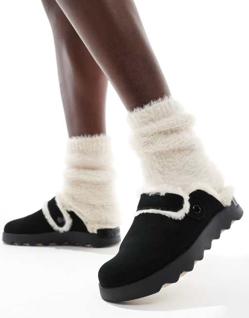 Sorel - Viibe Cozy - Suède klompen met imitatiebont in zwart en naturel