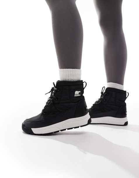 Sorel – Whitney III – Mittelhohe Winterstiefel in Schwarz und Creme - view 1