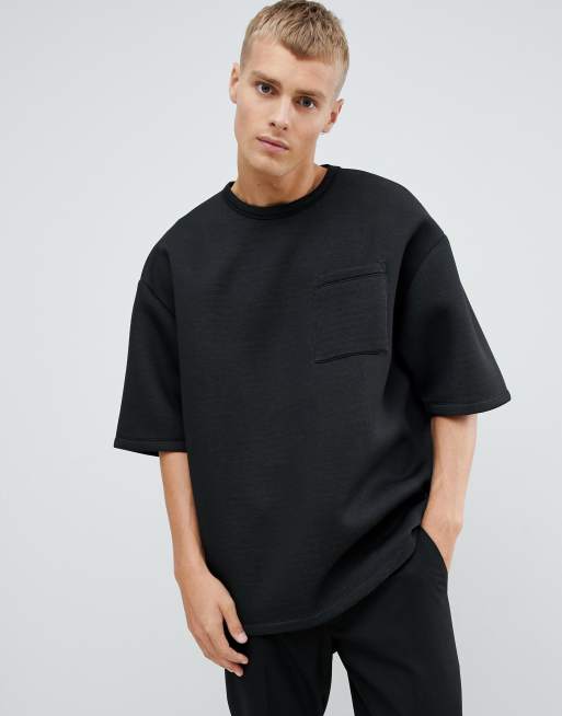 Sort oversized T-shirt med halvlange ærmer og lomme i scubastof fra ASOS DESIGN