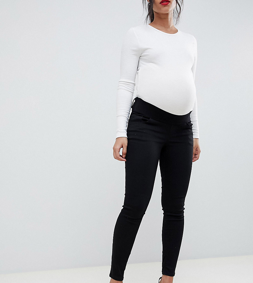 Sorte højtaljede Ridley skinny jeans med taljekant under maven fra ASOS DESIGN Maternity