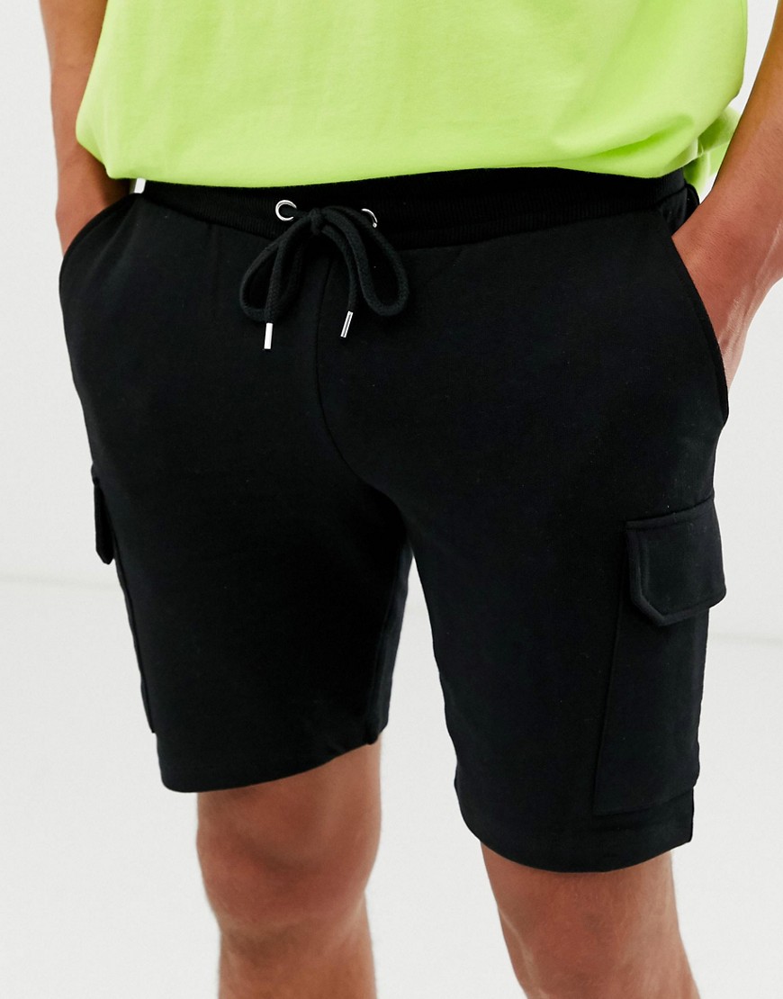 Sorte skinny shorts i jersey med cargo-lommer fra ASOS DESIGN-Gul