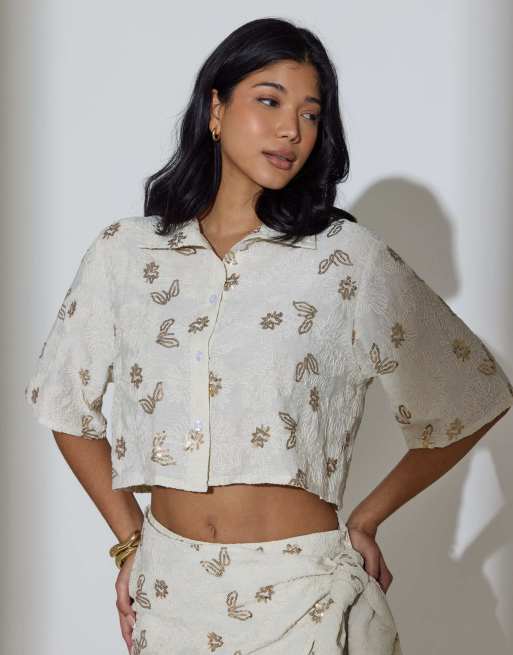 South Beach - Camicia a maniche corte color crema con ricamo floreale di paillettes