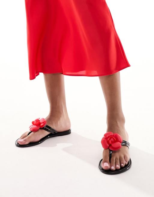 South Beach flower flip flops in black with red rose