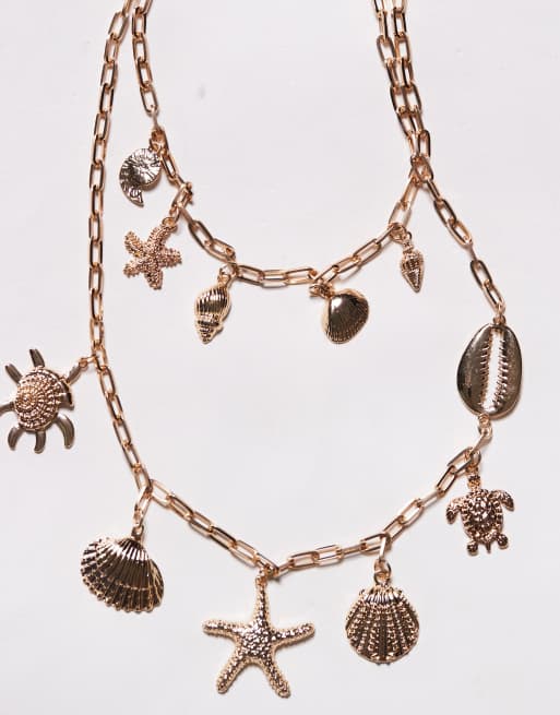 South Beach - Ketting met bedels van schelpen en zeesterren in goud, 2 van 3