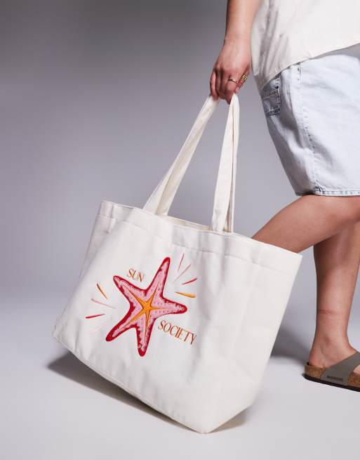 South Beach – Kremowa torba typu tote z materiału frotté z motywem słońca 