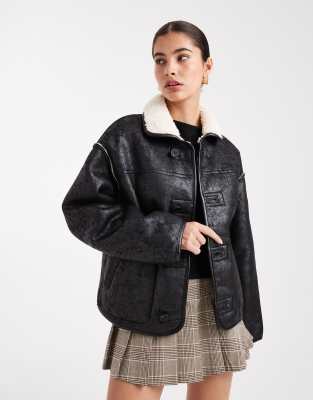 South Beach - Ladies - Wendbare Jacke mit Teddyfell und Kunstleder in Schwarz und Weiß sowie Knopfleiste-Bunt