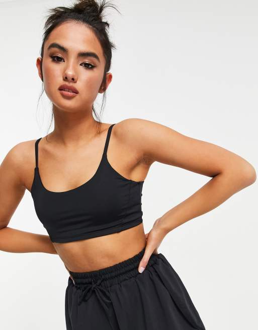 Nike Pro Training swoosh bra in white, ASOS