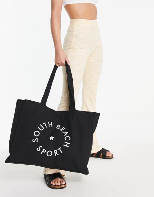 South Beach oversized canvas logo tote bag in black 