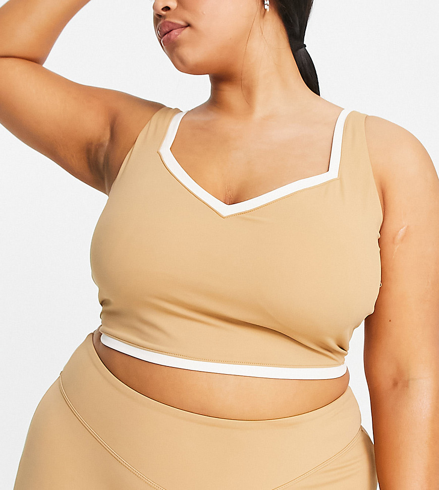 Plus-size top by South Beach Exclusive to ASOS Sweetheart neck Sleeveless style Cropped length Slim fit