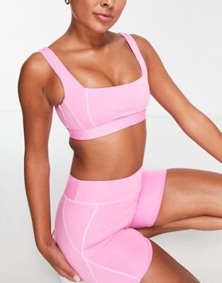 South Beach seam detail light support sports bra with contrast stitch in pink