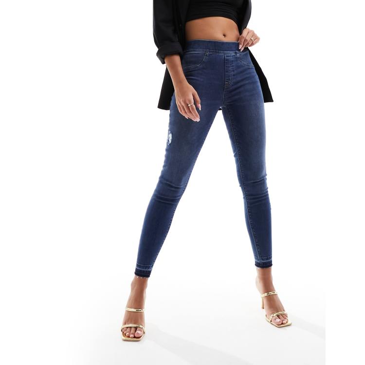 Spanx shape and lift distressed skinny jeans in medium wash blue