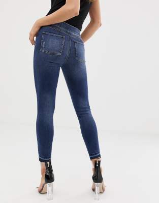 Spanx Shape And Lift Distressed Skinny Jeans in White