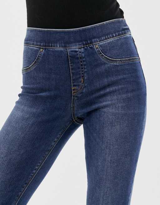 Spanx shape and lift distressed skinny jeans in mid wash