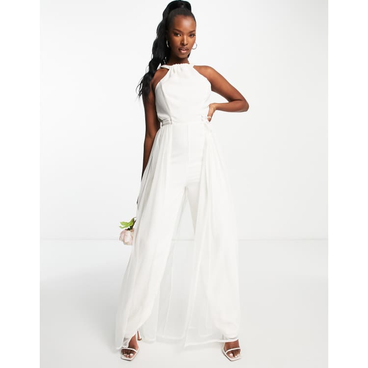 White jumpsuit 2025 with skirt overlay