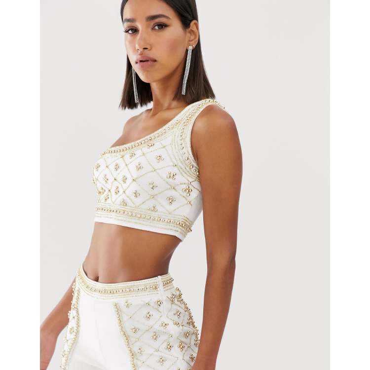 Starlet embellished longline one shoulder crop top in white and gold