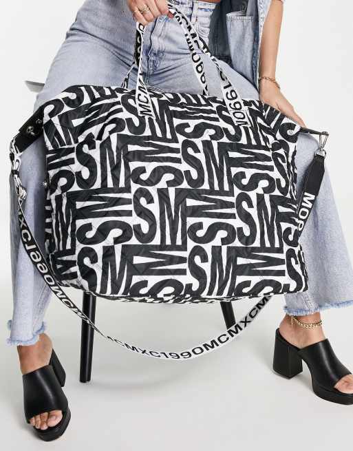 Steve Madden Bgetaway large duffle bag in black and white logo print