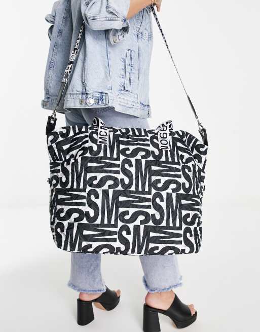 Steve Madden Bgetaway large duffle bag in black and white logo print