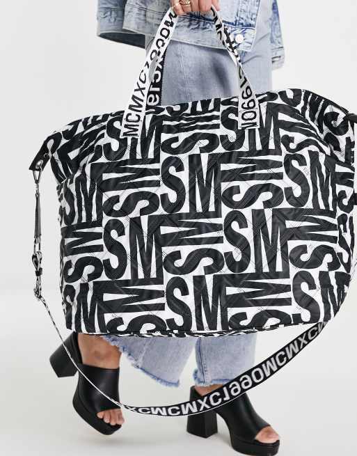 Steve Madden Bgetaway large duffle bag in black and white logo print