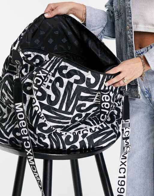 Steve Madden Bgetaway large duffle bag in black and white logo print