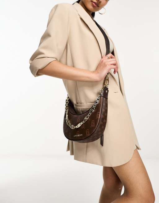 Steve Madden Bmelt sling bag in brown monogram