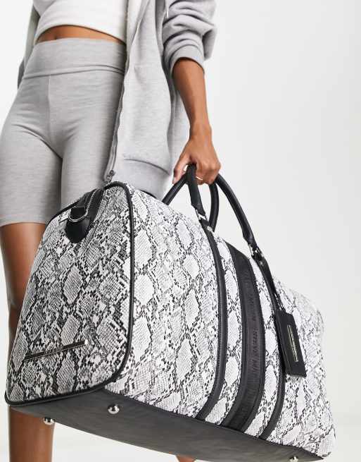 Steve Madden snake print weekender in black