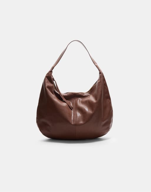 Stradivarius - Borsa da spalla a mezzaluna color cammello pallido