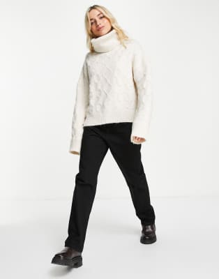 sleeveless cable roll neck jumper