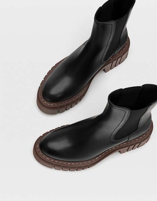 Black boots 2025 brown sole