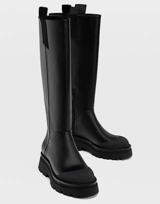 Stradivarius chunky sole high leg boots in black | ASOS